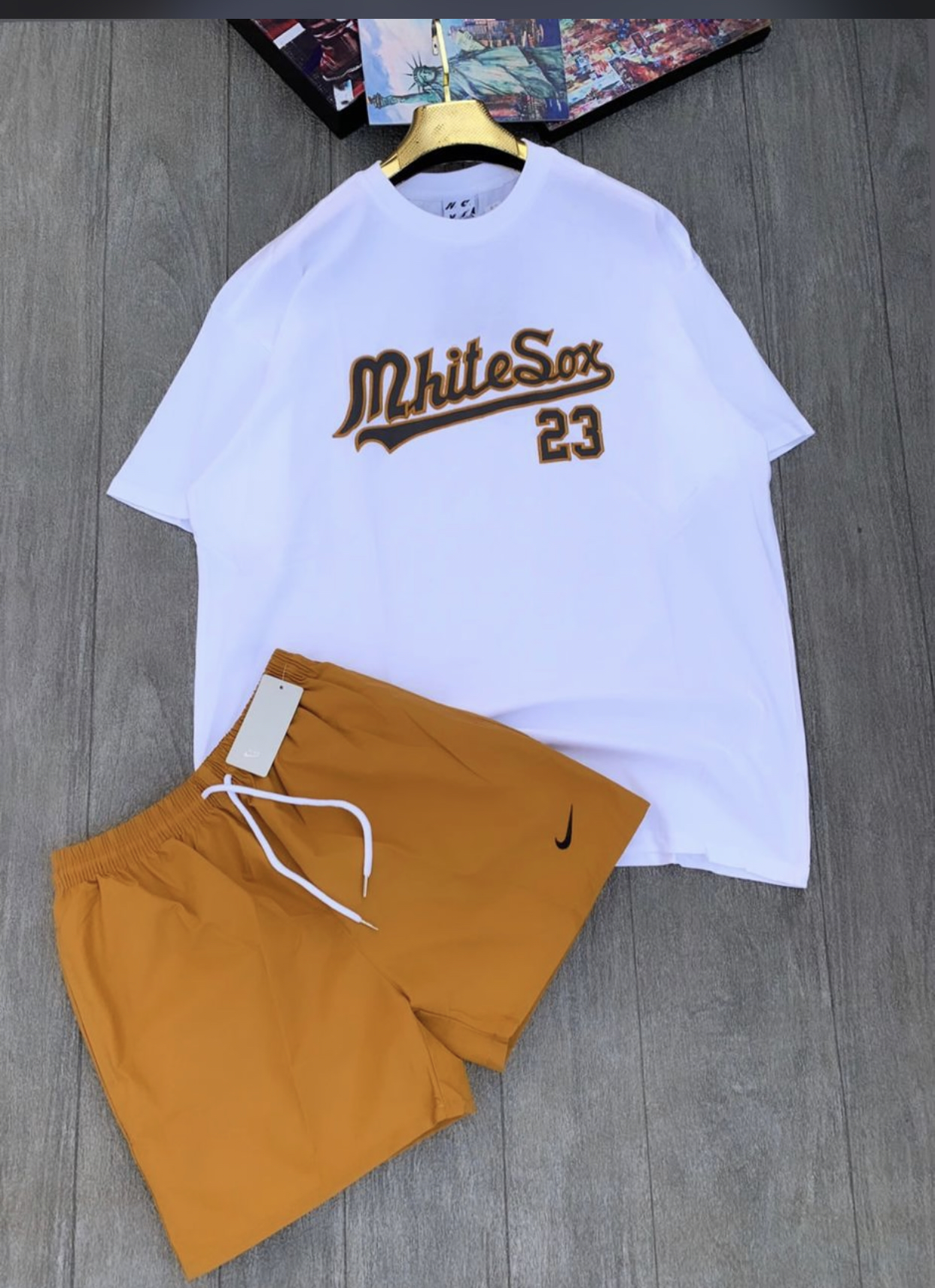 white t-shirt and brown shorts