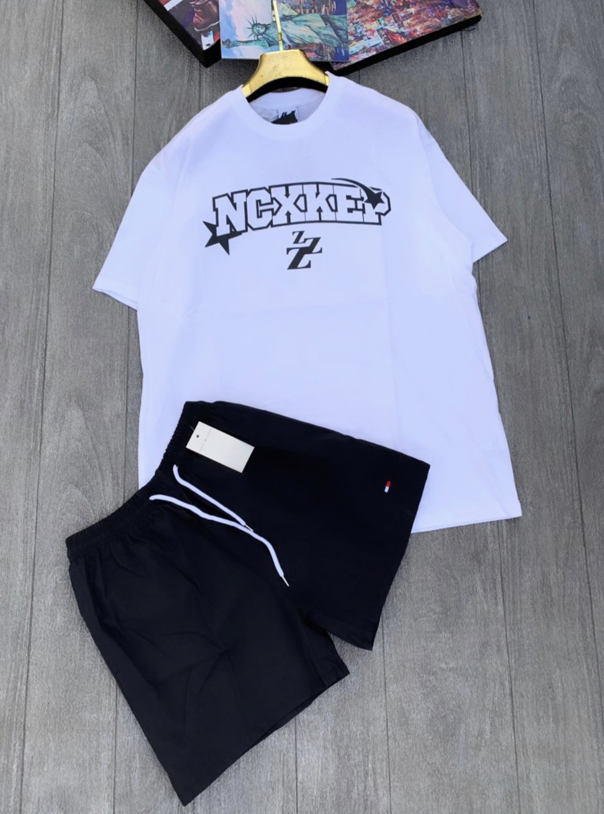 white t shirt and black shorts