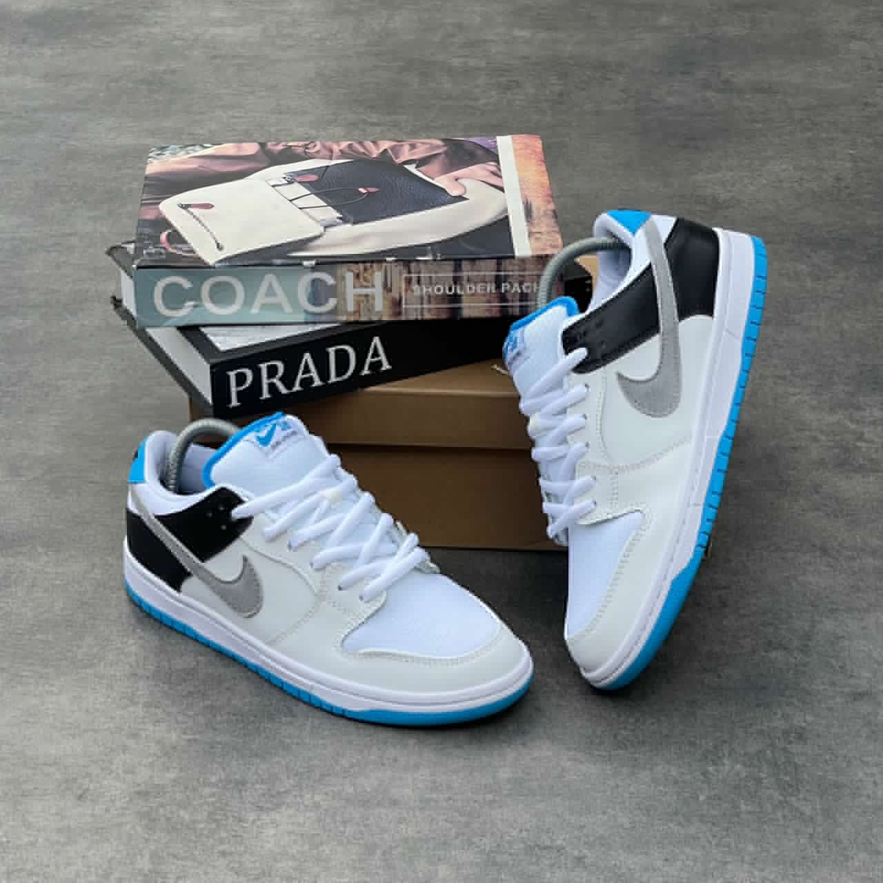 NIKE AIR CREAM AND BLACK WITH BLUE SOLE